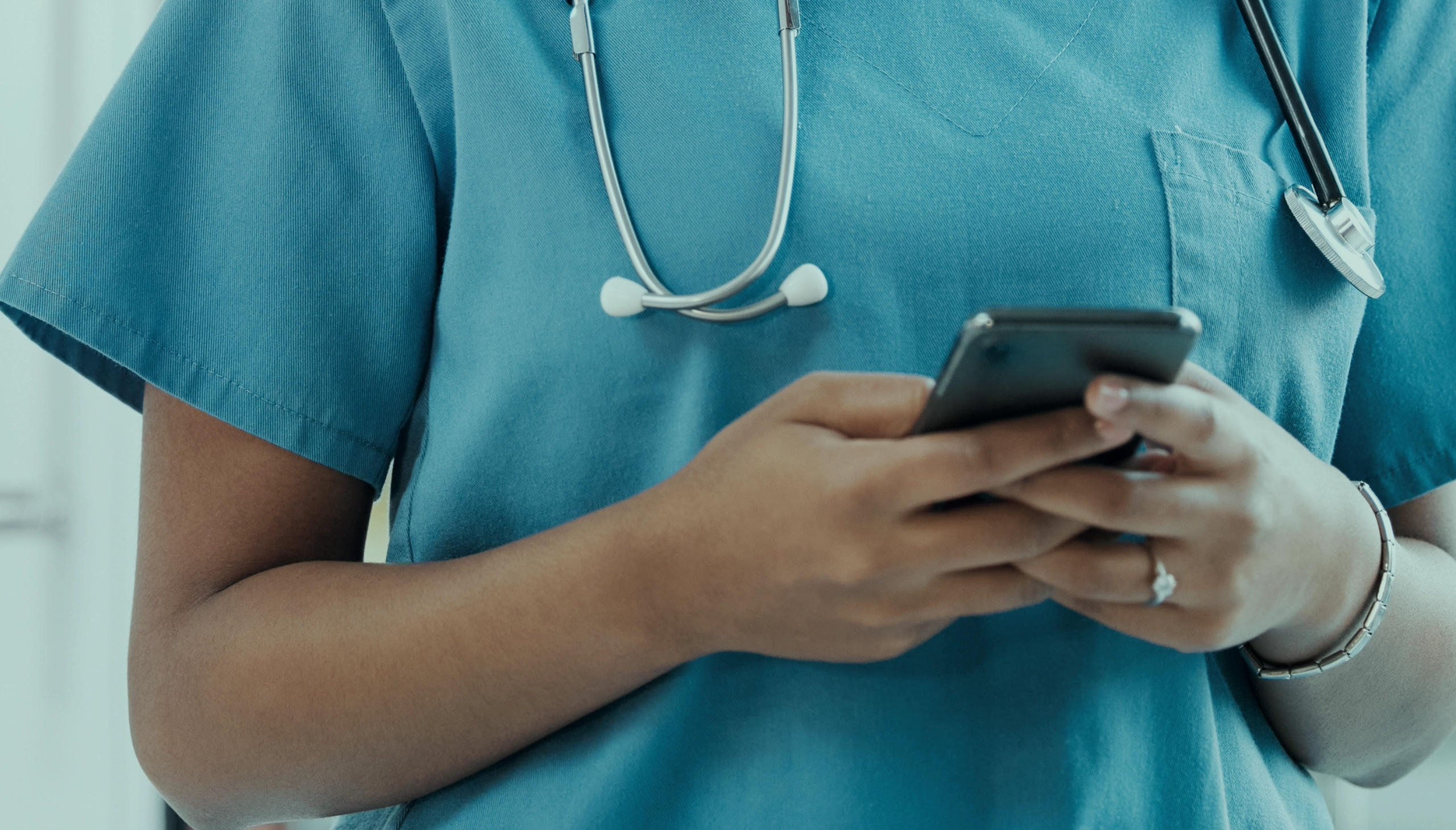 healthcare staff hands on a phone