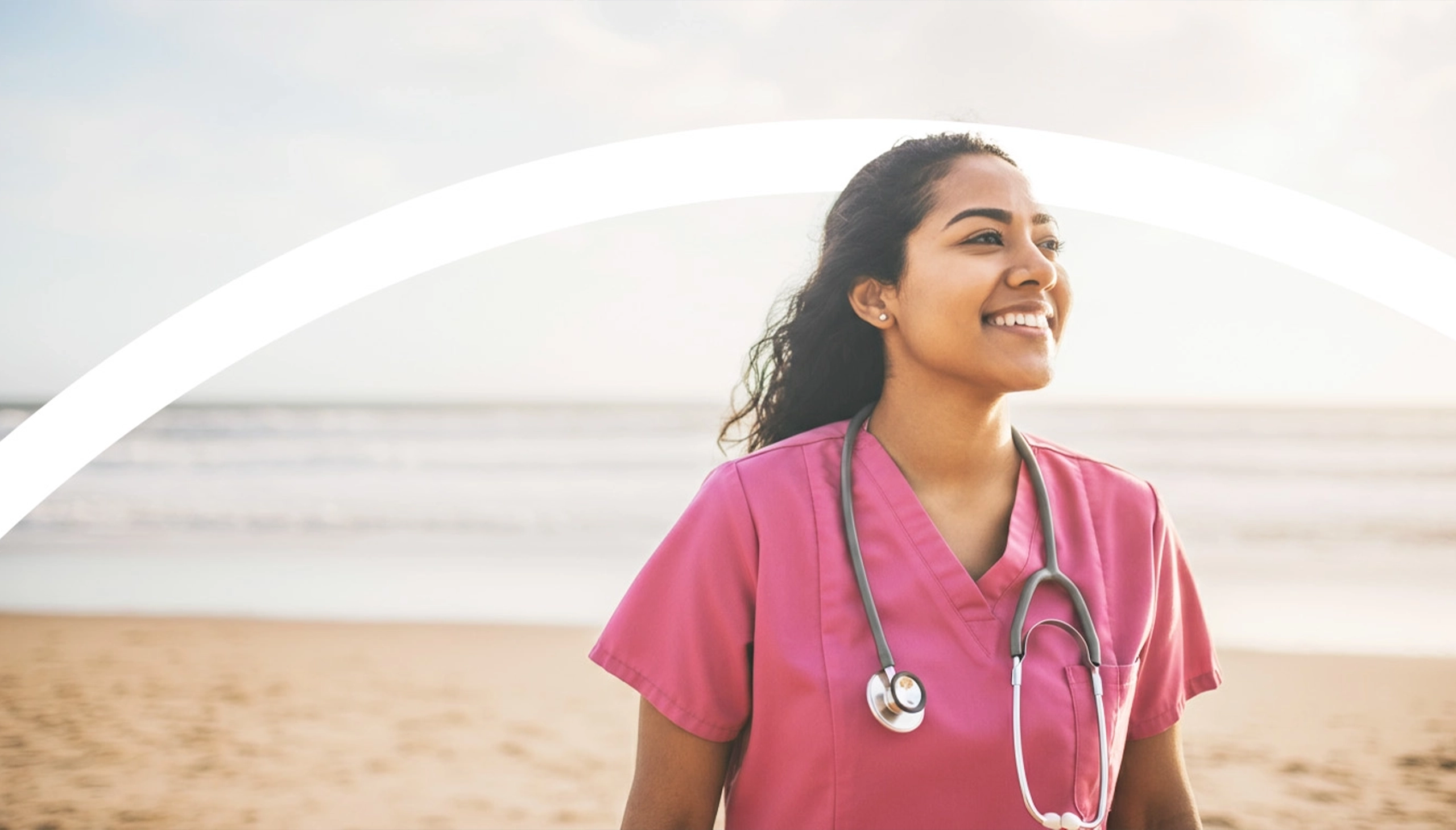 healthcare staff smiling on a beach